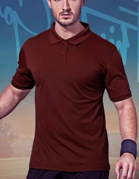 A man in a maroon polo shirt and black shorts.