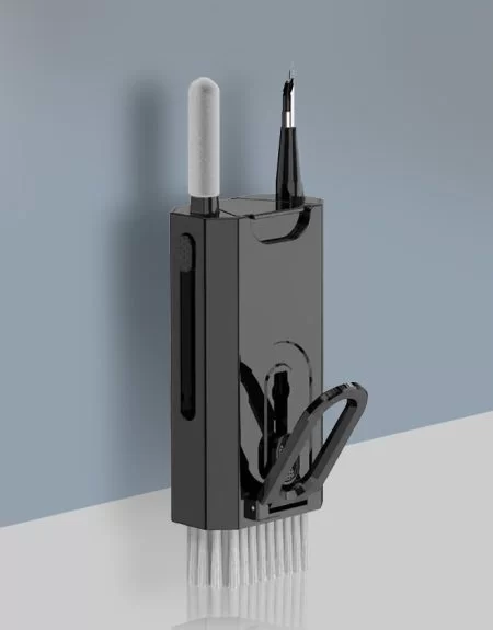 This pen holder, mounted on a black wall, comes with a pen and is ideal for keeping your writing essentials organized.