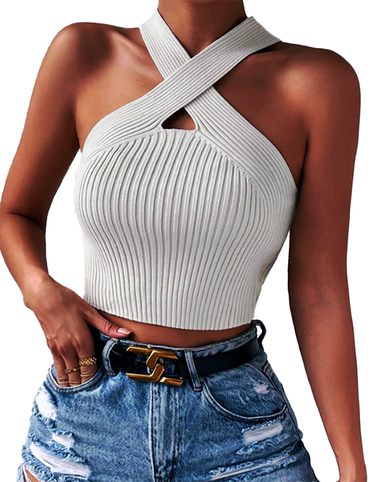 A woman in a white crop top and denim shorts, looking stylish and ready for a summer day.